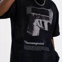 Men's Graphic Round Neck Oversized T-Shirt featuring a bold gun design in black and white.