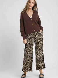 Umgee Button-Front V-Neck Knit Cardigan styled with leopard print pants, perfect for a chic layering look.