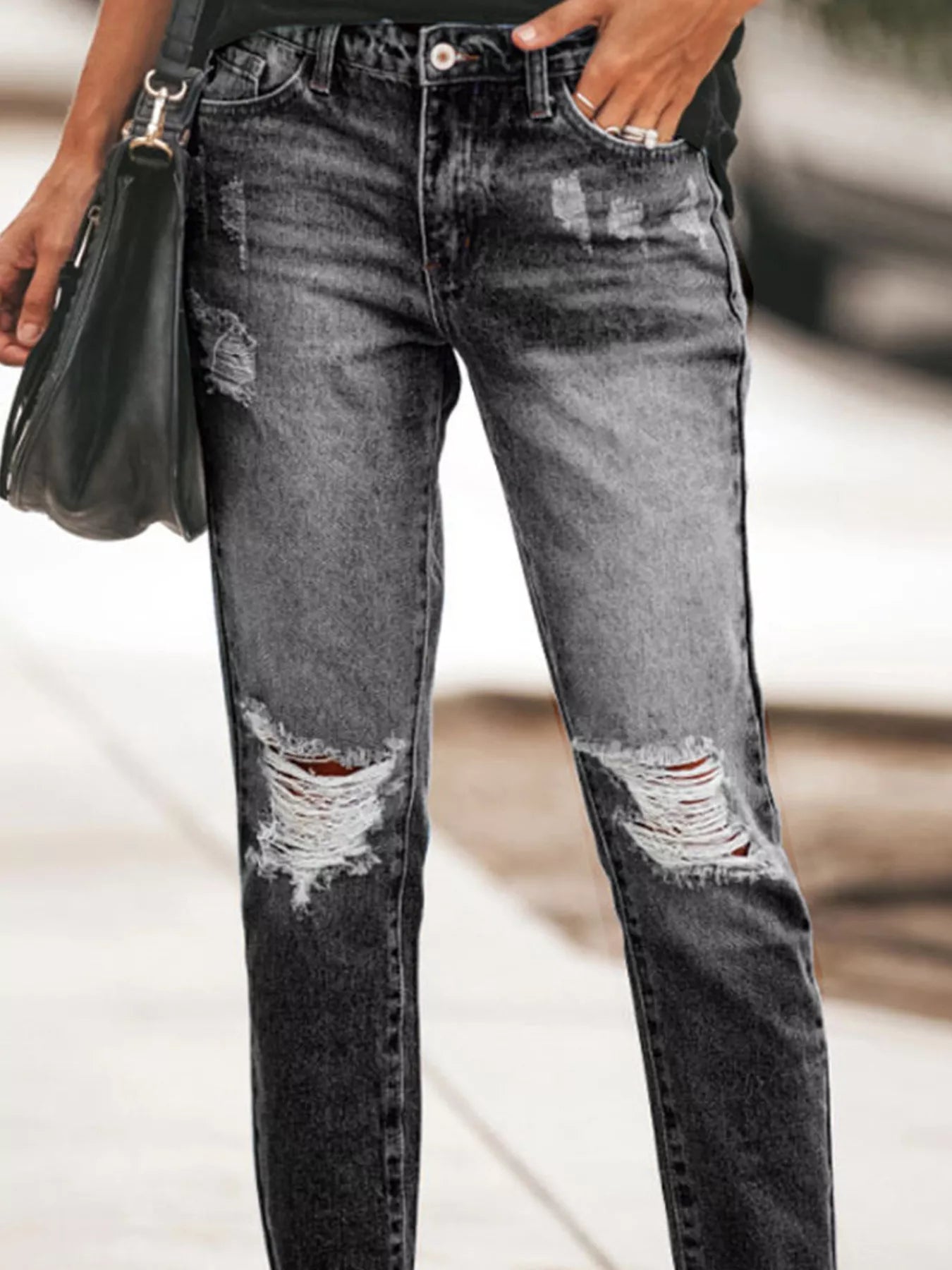 Distressed Wash Ankle Jeans with ripped details and raw hem, perfect for casual wear.