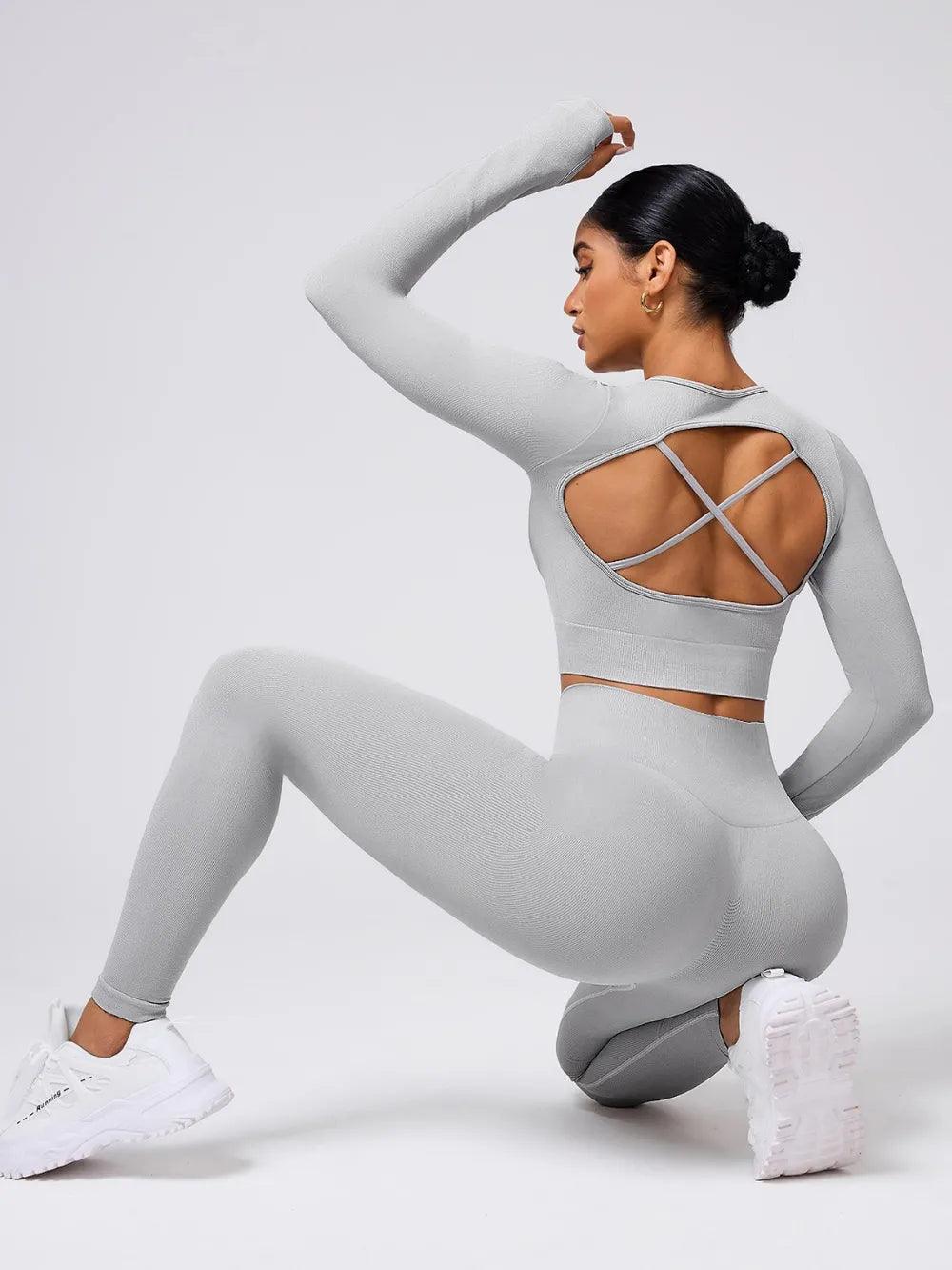 Back Crisscross Round Neck Long Sleeve Top and Leggings Active Set in grey showcasing stylish design and functionality.