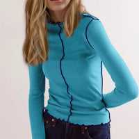 Basic Bae Contrast Trim Mock Neck Long Sleeve T-Shirt in blue with contrasting trim, model showcasing its stylish fit.