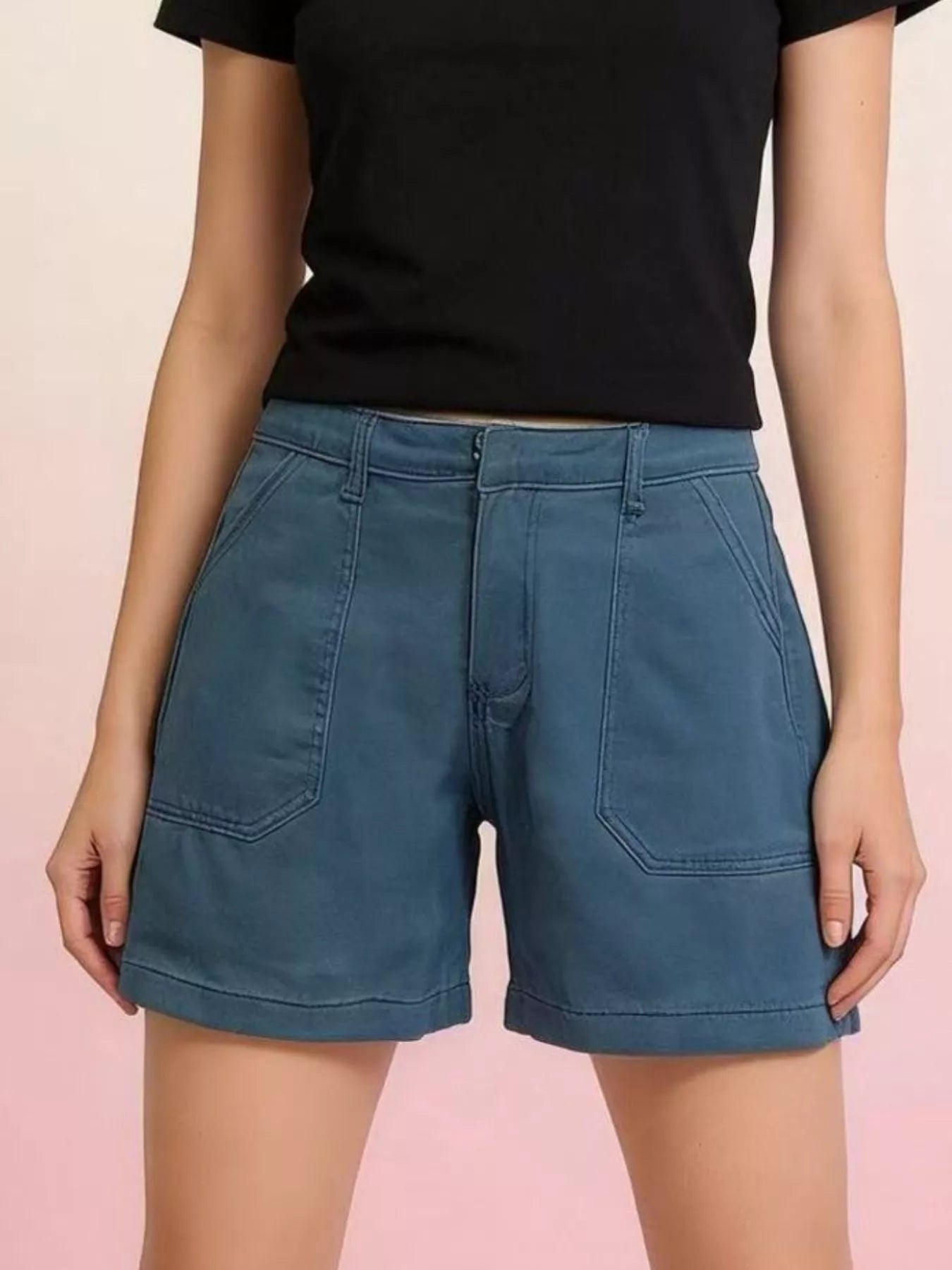 Stylish Pocketed Denim Shorts in blue with front pockets and a button closure, perfect for summer wear.