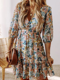 Floral Print Ruffle Hem Mini Dress showcased on a model with long hair, in a colorful floral design with ruffles.