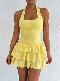 Yellow halter neck ruffle layered mini dress with tiered ruffles and fitted bodice