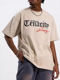 Men's TENACITY Round Neck Short Sleeve T-Shirt in beige with graphic design features, perfect for casual wear.
