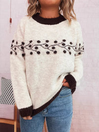 Contrast Hem Round Neck Sweater featuring floral embroidery in black and white, styled with casual jeans.