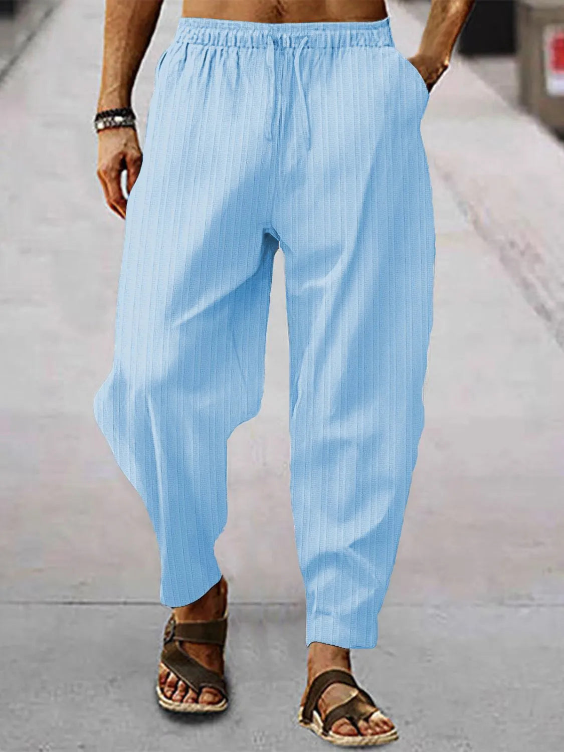 Men's full size drawstring pants with pockets in light blue, basic style, perfect for casual wear.