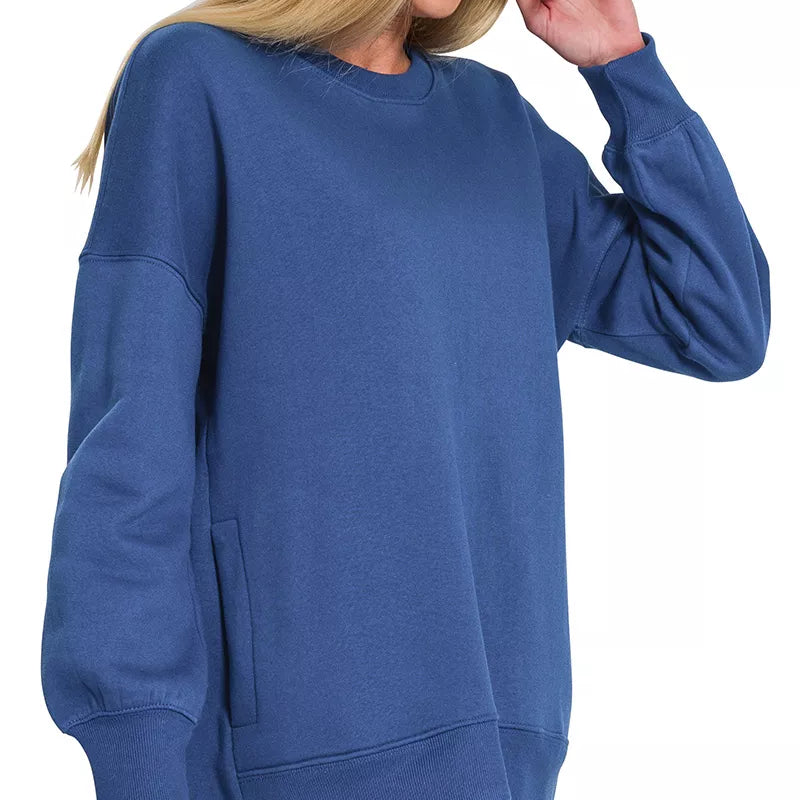 Zenana Fleece Hi-low Boyfriend Sweatshirts with Pockets in LT Navy worn by model, showcasing relaxed fit and stylish hemline.