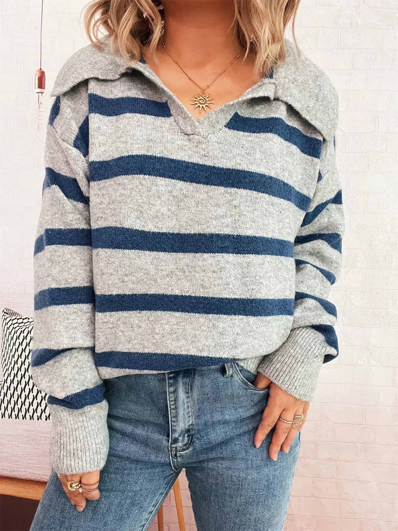 Striped Dropped Shoulder Sweater featuring a cozy oversized design in gray and navy stripes.