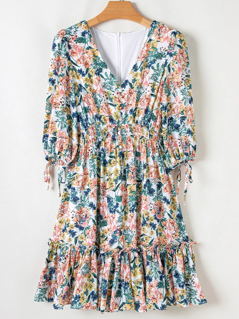 Floral Print Ruffle Hem Mini Dress featuring ruffles, smocked details, and a vibrant floral pattern.