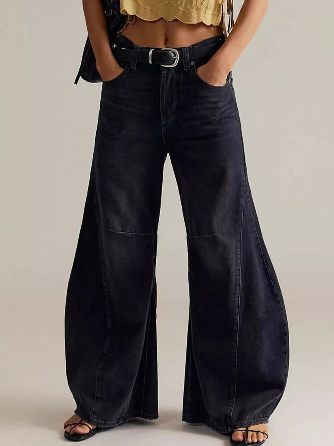 Model wearing Washed Wide Leg Jeans with a stylish belt and top, showcasing a trendy fashion look.