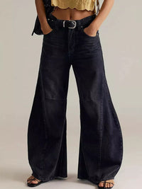 Model wearing Washed Wide Leg Jeans with a stylish belt and top, showcasing a trendy fashion look.
