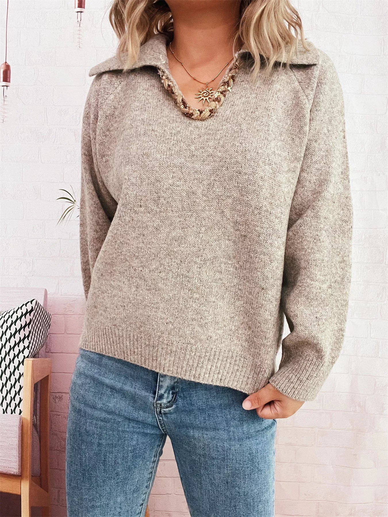 Ribbed Hem Raglan Sleeve Sweater worn with jeans, featuring a v-neck and collar for a stylish, relaxed look.