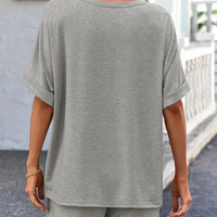 Back view of a model wearing a Round Neck T-Shirt and Drawstring Shorts Set in gray, showcasing its casual style.