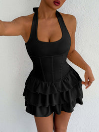 Black halter neck ruffle mini dress with layered skirt and seamed bodice front
