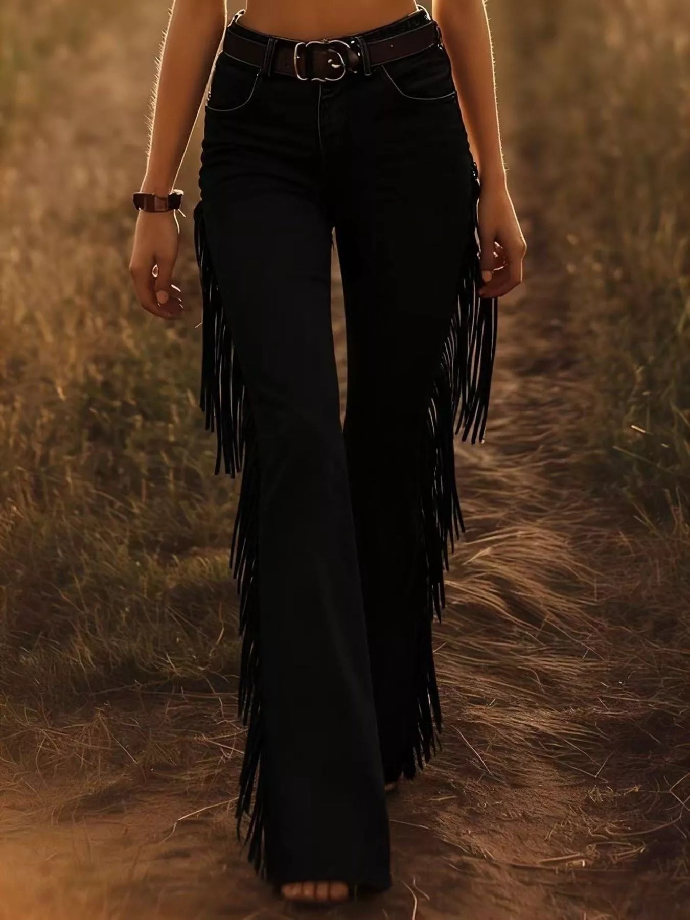 Woman wearing Fringe Trim Flare Pants with fringe detailing, set against a natural background.