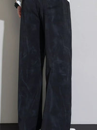 Men's Loose Fit Casual Pants featuring a dark color and a loose silhouette, ideal for casual wear.