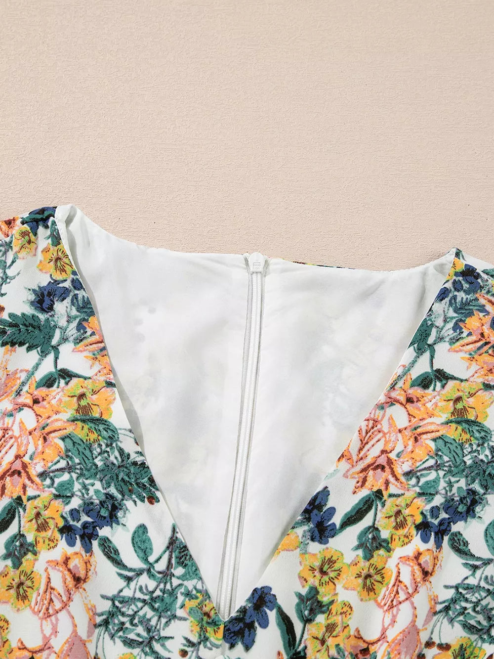 Floral Print Ruffle Hem Mini Dress back view showcasing the zipper and floral design.
