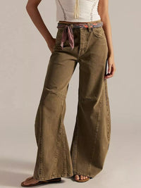 Model wearing Washed Wide Leg Jeans in olive color with a stylish belt and top.