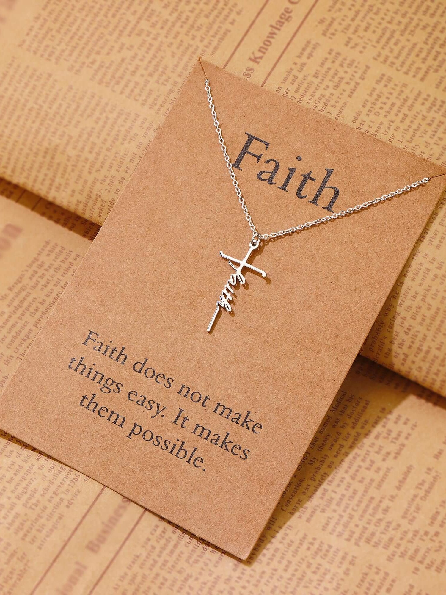 Lcherry Faith Cross Necklace displayed on brown card with inspirational quote about faith and possibility.