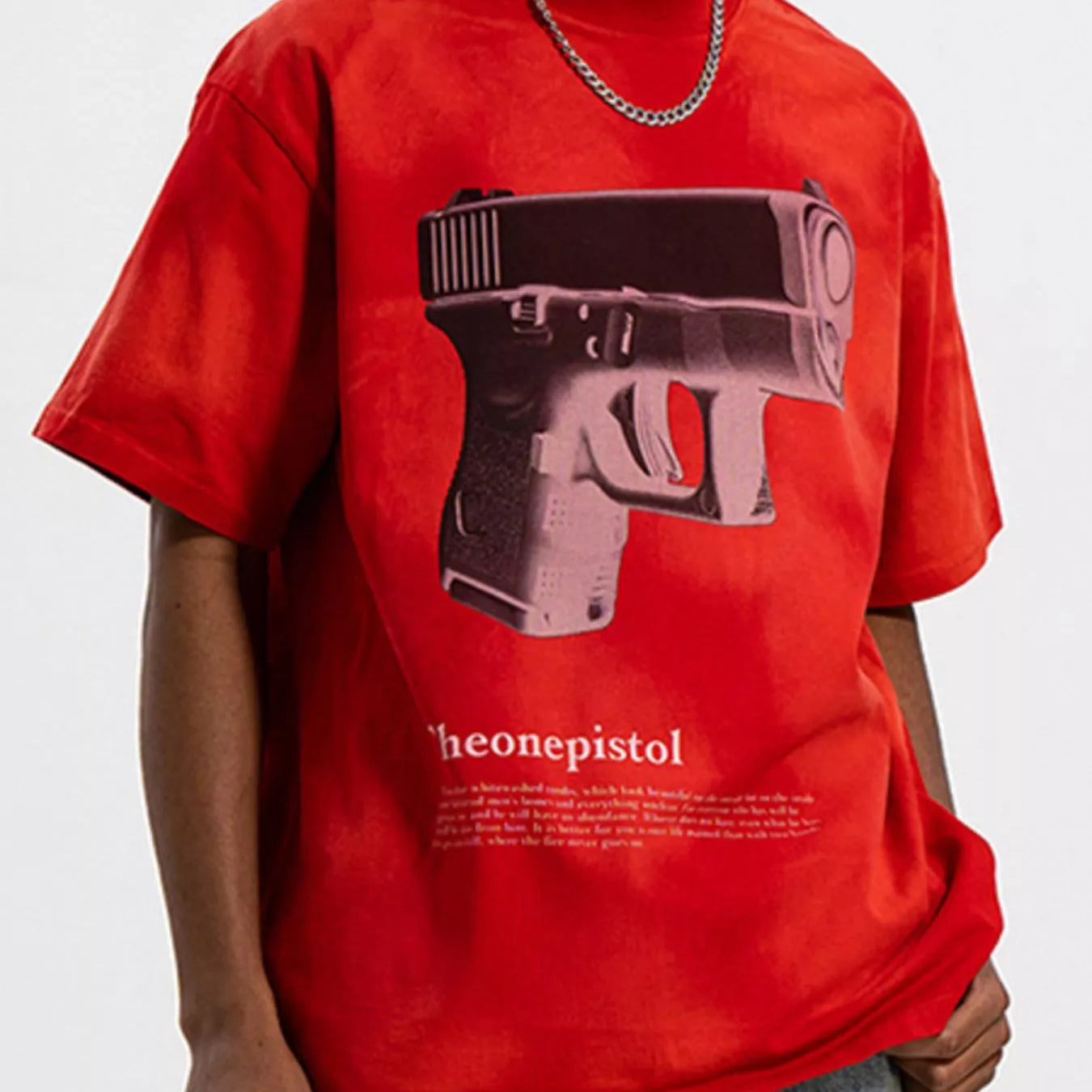 Men's Graphic Round Neck Oversized T-Shirt featuring a bold gun graphic on a red background.