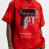 Men's Graphic Round Neck Oversized T-Shirt featuring a bold gun graphic on a red background.