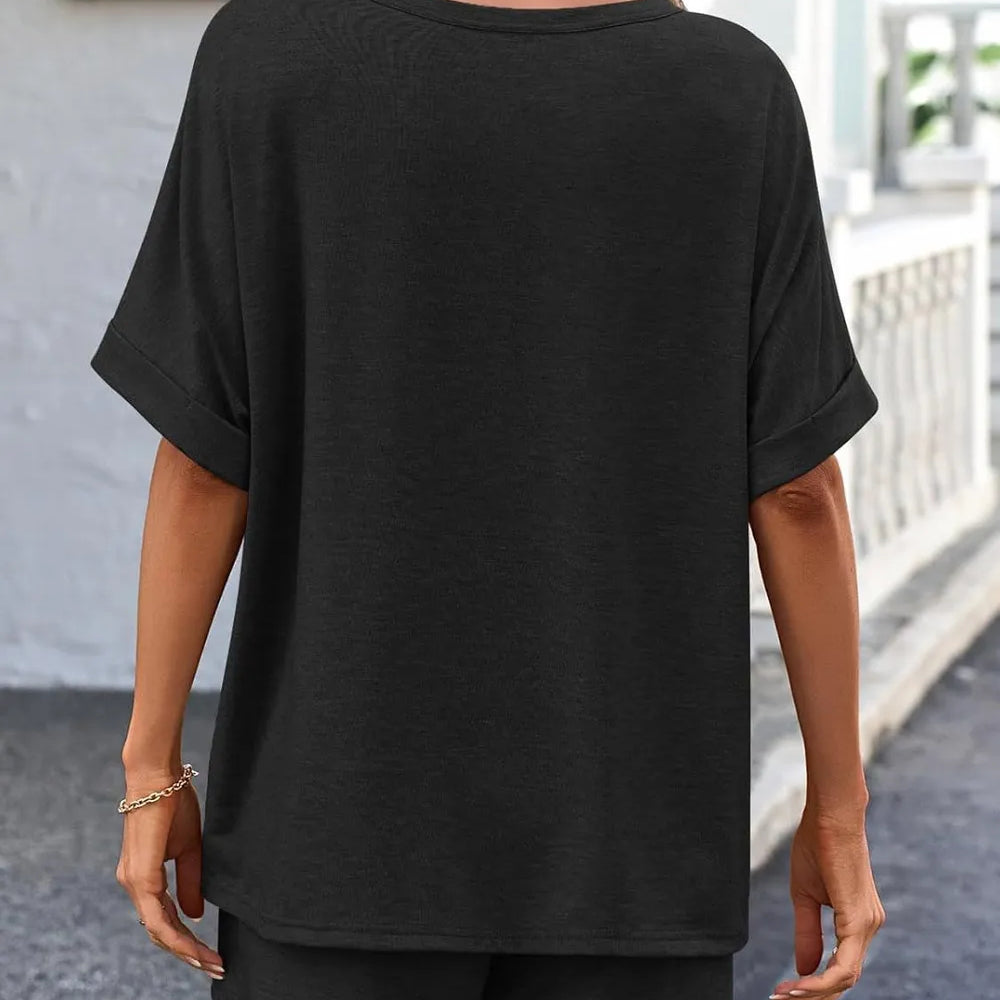 Back view of a woman wearing a Round Neck T-Shirt and Drawstring Shorts Set in black, showcasing casual comfort.