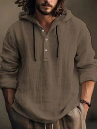 Men's half button hoodie in soft brown color, featuring a casual style with a hood and long sleeves, made from 100% cotton.