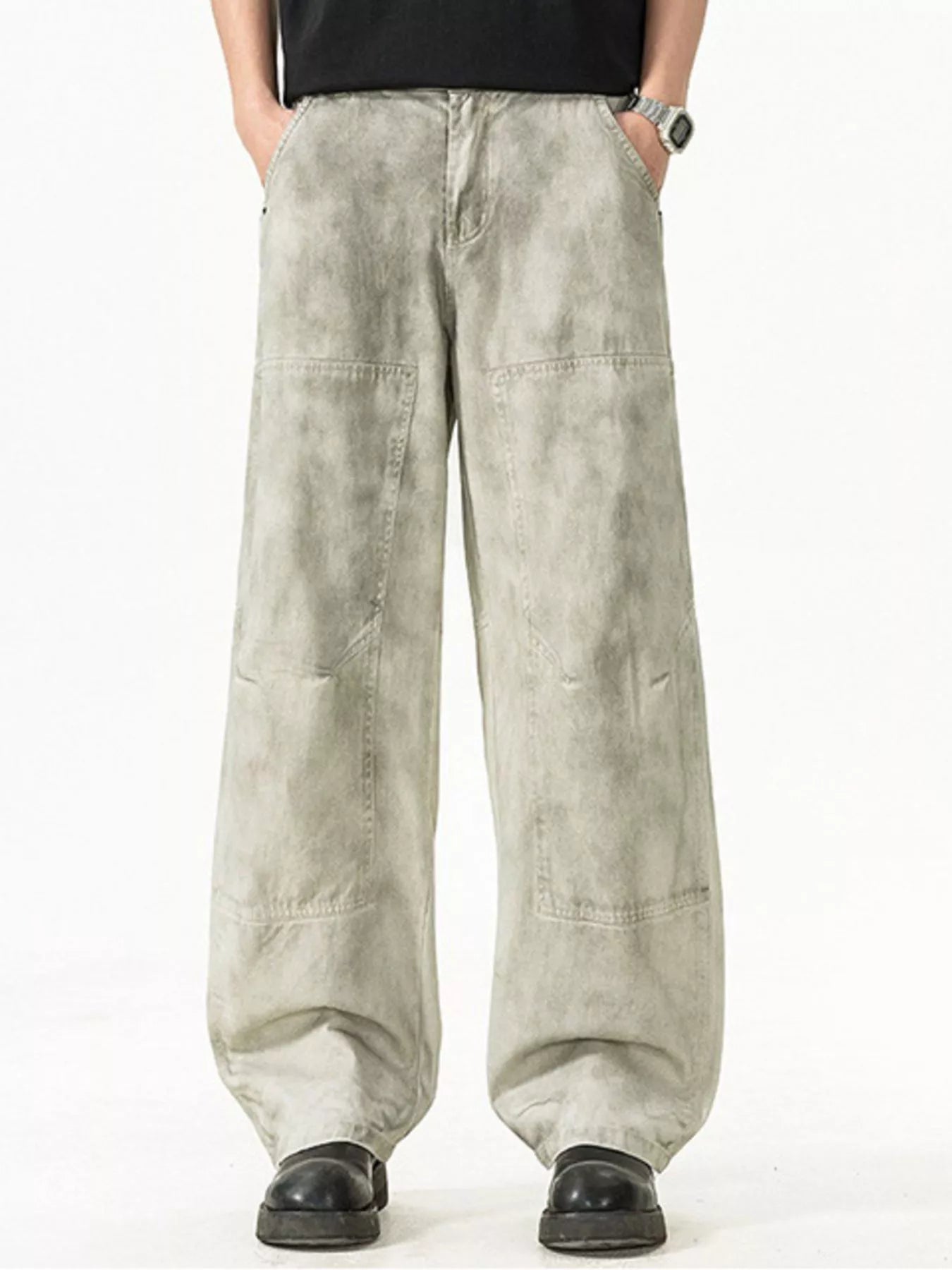 Men's Plus Size Loose Fit Casual Pants displayed on a model, featuring a unique grey design and roomy pockets.
