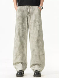 Men's Plus Size Loose Fit Casual Pants displayed on a model, featuring a unique grey design and roomy pockets.