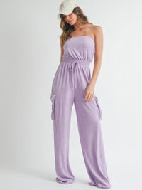 Model wearing a stylish Tube Top Jumpsuit Romper in lavender with a cap, perfect for casual outings.