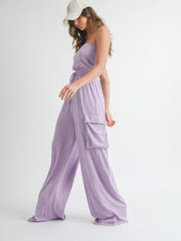 Model wearing a stylish Tube Top Jumpsuit Romper in lavender color, showcasing relaxed summer vibes.