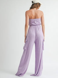 Back view of a woman wearing a Tube Top Jumpsuit Romper in lavender, showcasing its relaxed fit and casual style.