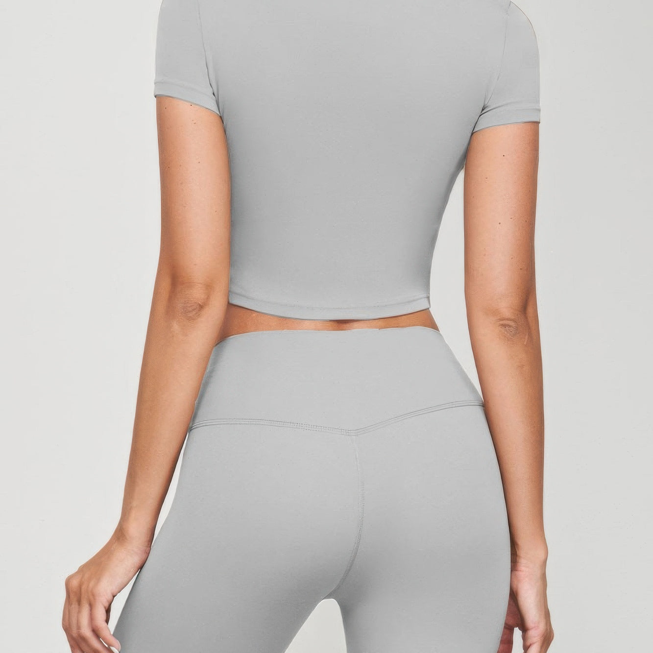Seamless Short Sleeve Crop Tee in grey, fitted silhouette, perfect for pairing with high-waisted bottoms.