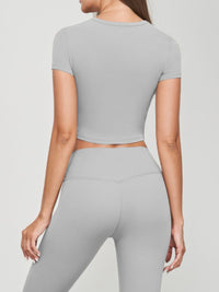 Seamless Short Sleeve Crop Tee in grey, fitted silhouette, perfect for pairing with high-waisted bottoms.