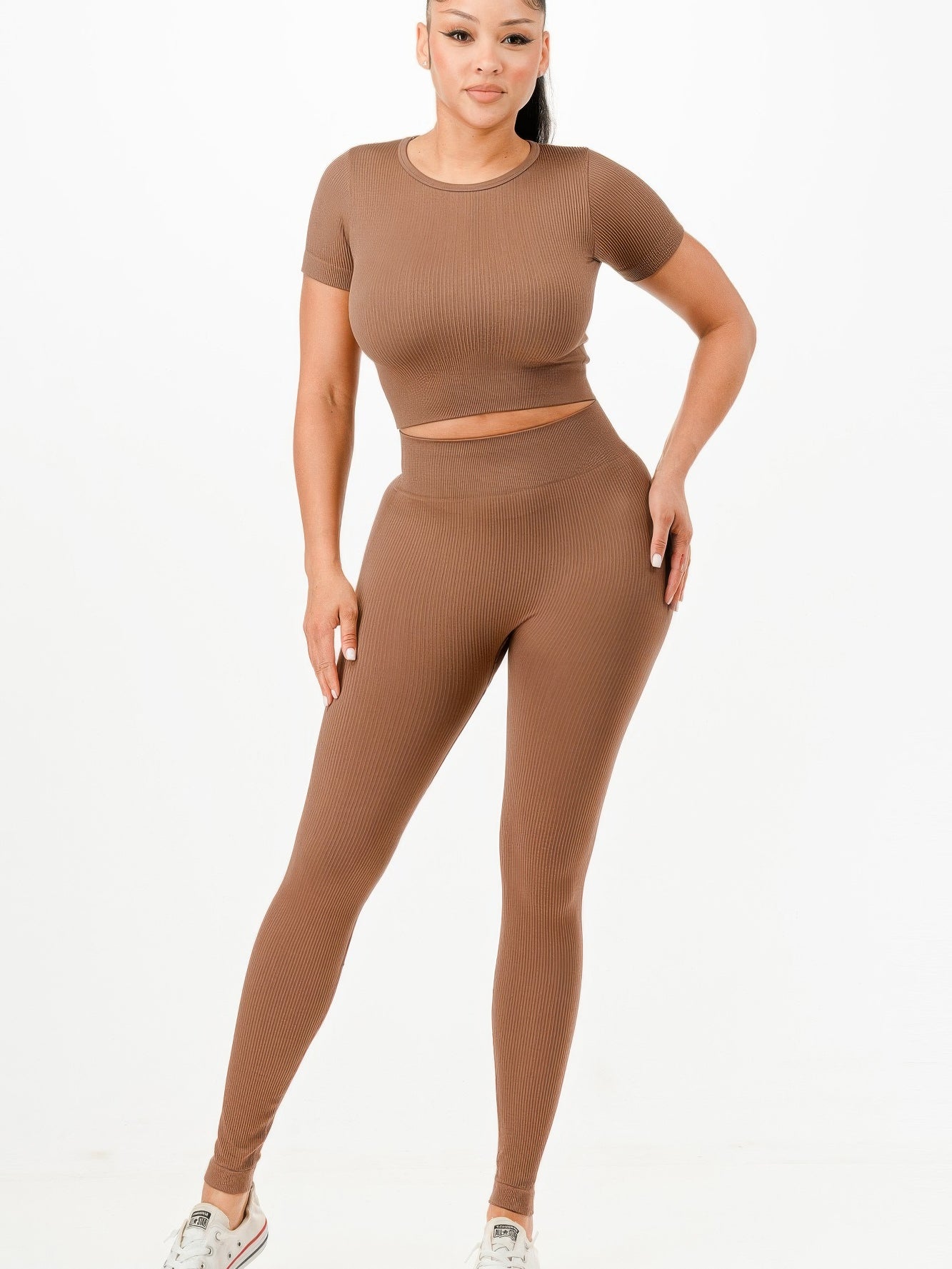 Ribbed seamless activewear set featuring a cropped top and high-waist leggings in a stylish brown color.