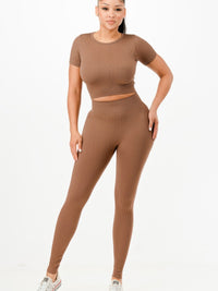 Ribbed seamless activewear set featuring a cropped top and high-waist leggings in a stylish brown color.