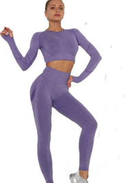 Model showcasing seamless leggings set in purple, featuring a crop top and high-waisted leggings for a stylish workout.