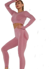 Seamless activewear set featuring a crop top and high-waisted leggings in a stylish pink color.