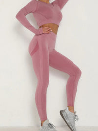 Seamless activewear set featuring a pink seamless crop top and matching leggings, ideal for stylish workouts.