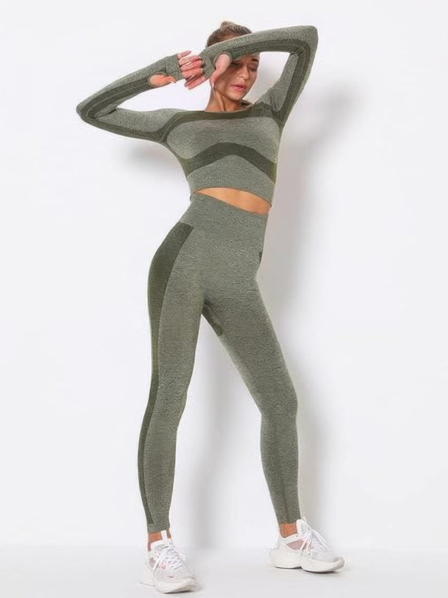 Model showcasing a seamless long sleeve yoga set in a trendy color block design, perfect for workouts and comfort.