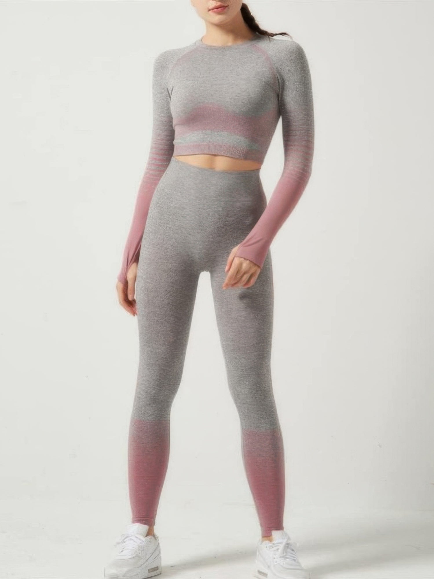 Stripe seamless yoga set featuring a long sleeve crop top and matching skinny-fit leggings in gray and pink.