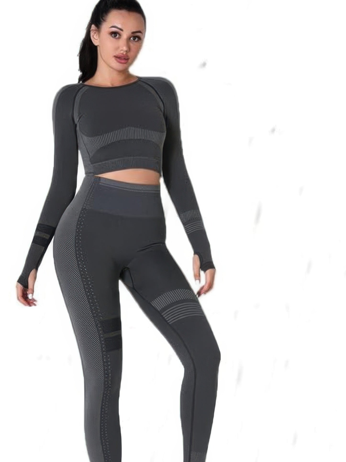 Seamless long sleeve yoga set model wearing a gray crop top and high-waisted leggings for comfort and style.