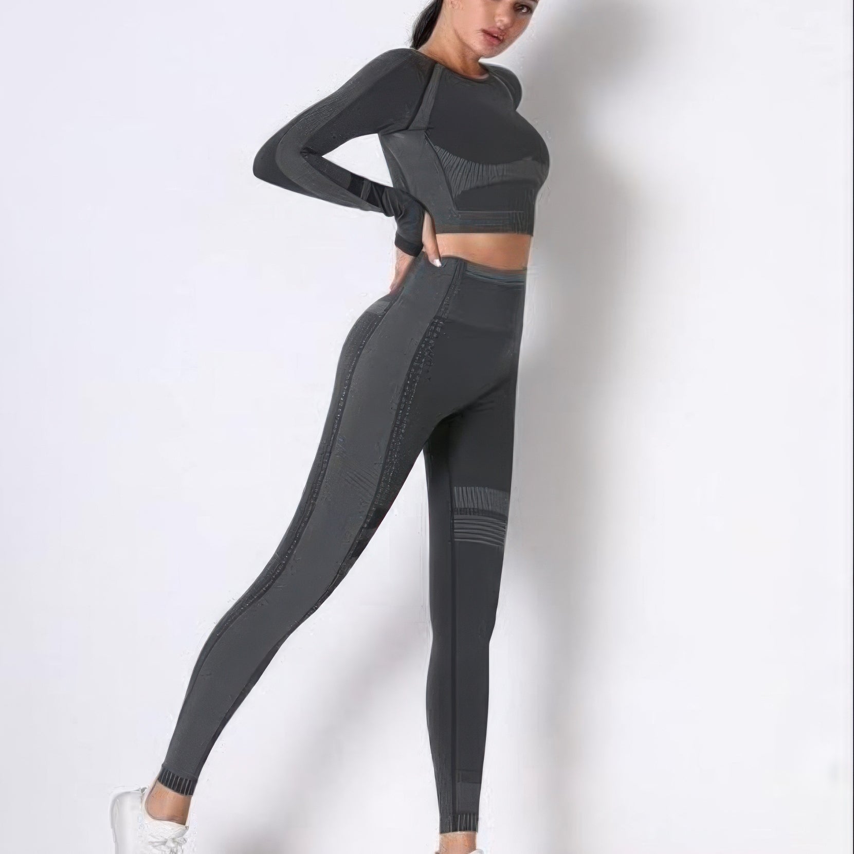 Seamless long sleeve yoga set featuring a form-fitting crop top and high-waisted leggings in grey.