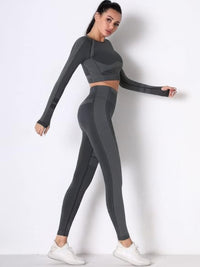 Model showcasing a seamless long sleeve yoga set with high-waisted leggings in grey, ideal for workouts and comfort.