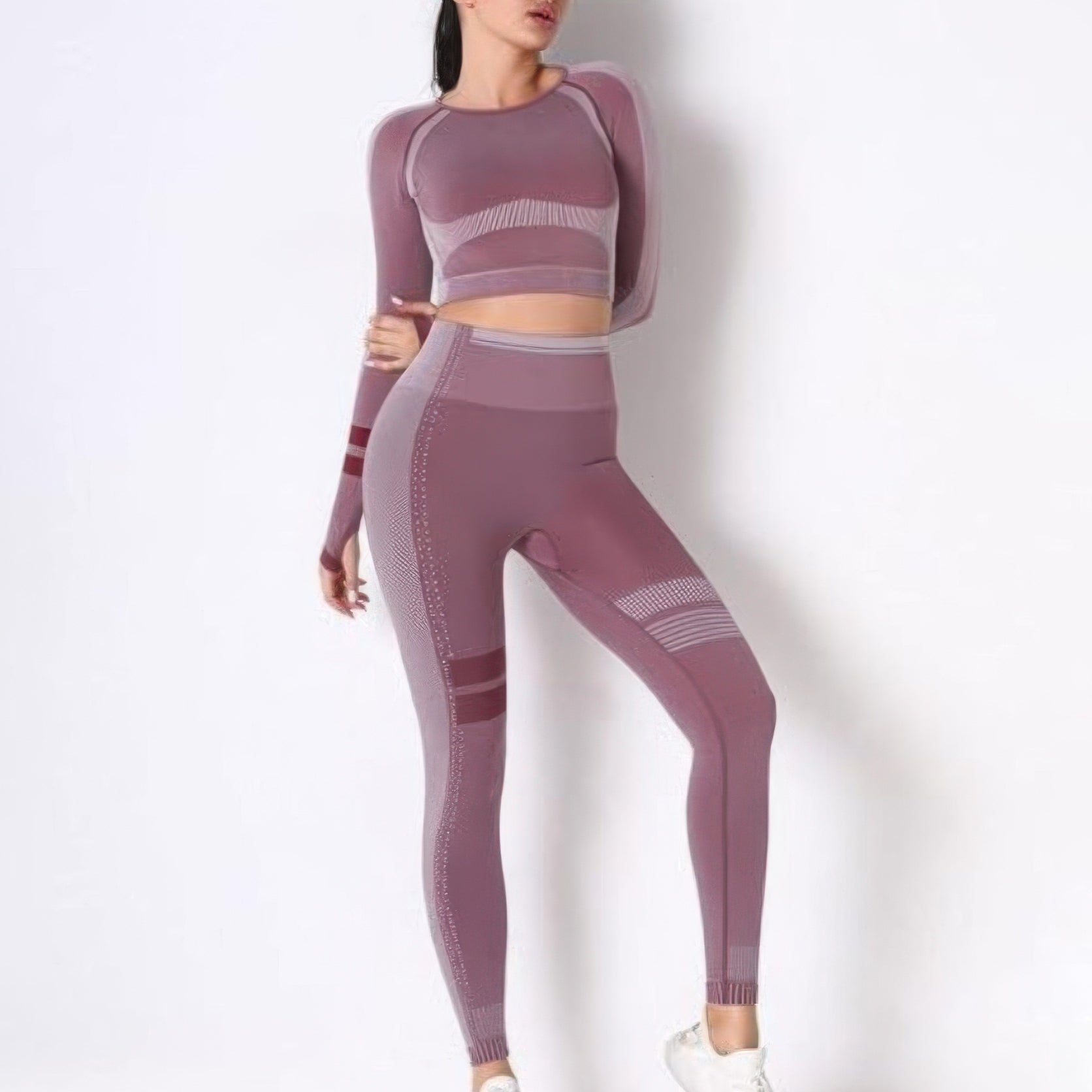 Seamless long sleeve yoga set featuring a fitted crop top and high-waisted leggings in a stylish design.