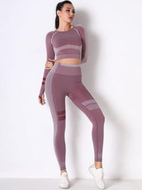 Seamless long sleeve yoga set featuring a fitted crop top and high-waisted leggings in a stylish design.