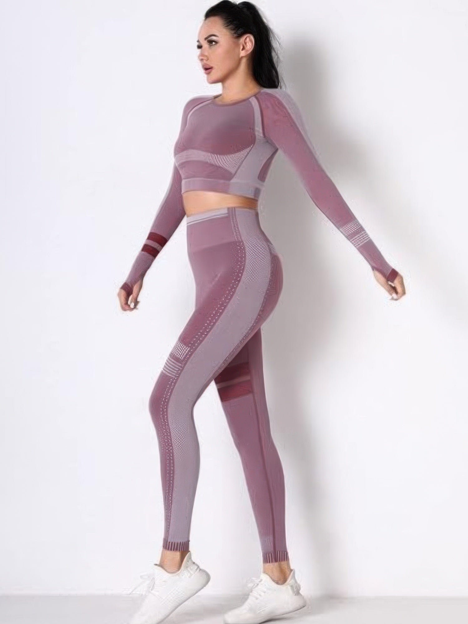 Seamless long sleeve yoga set featuring a fitted crop top and high-waisted leggings in stylish pink hues.