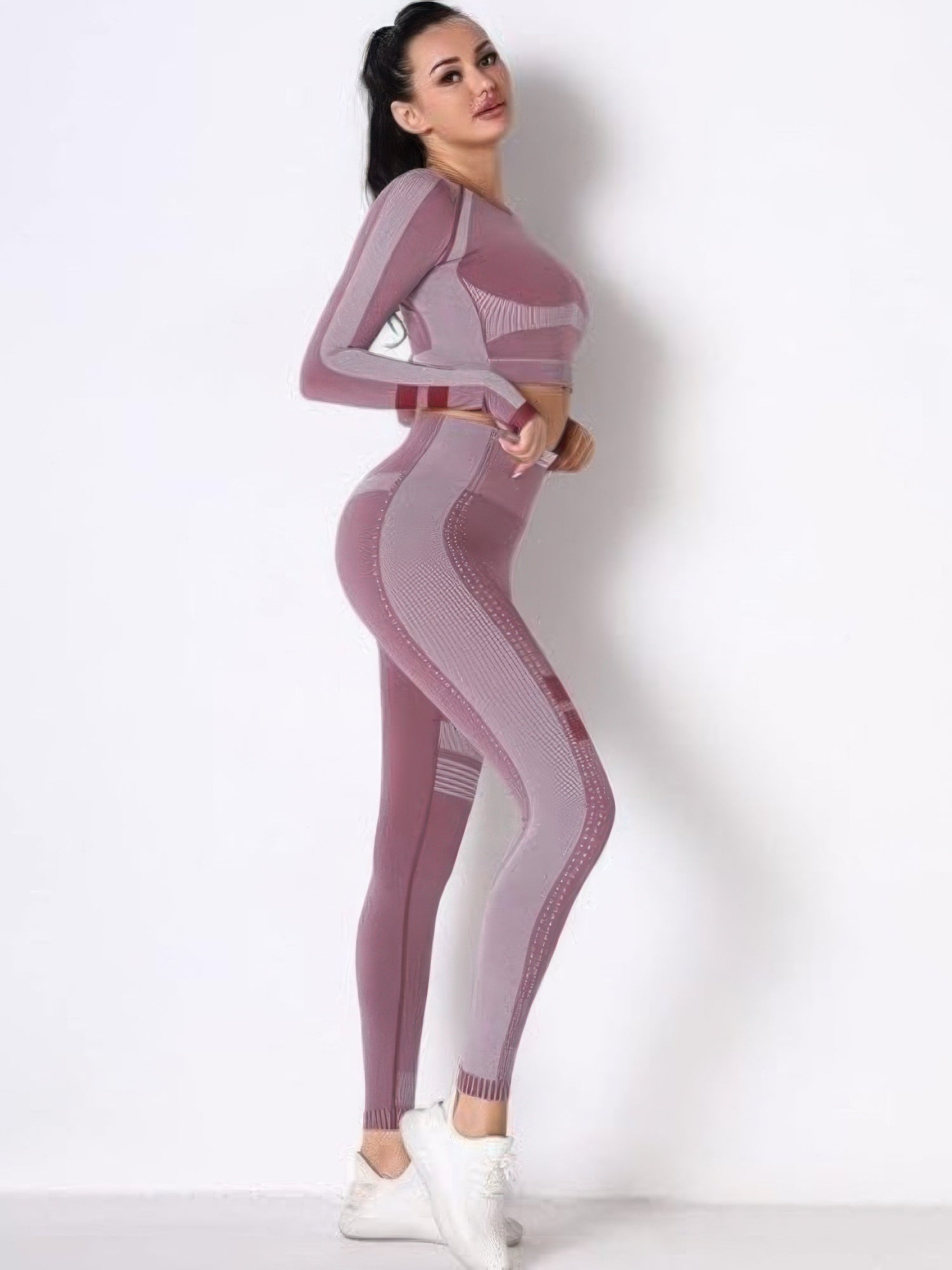 Seamless long sleeve yoga set in a stylish pink design, perfect for workouts and casual wear.