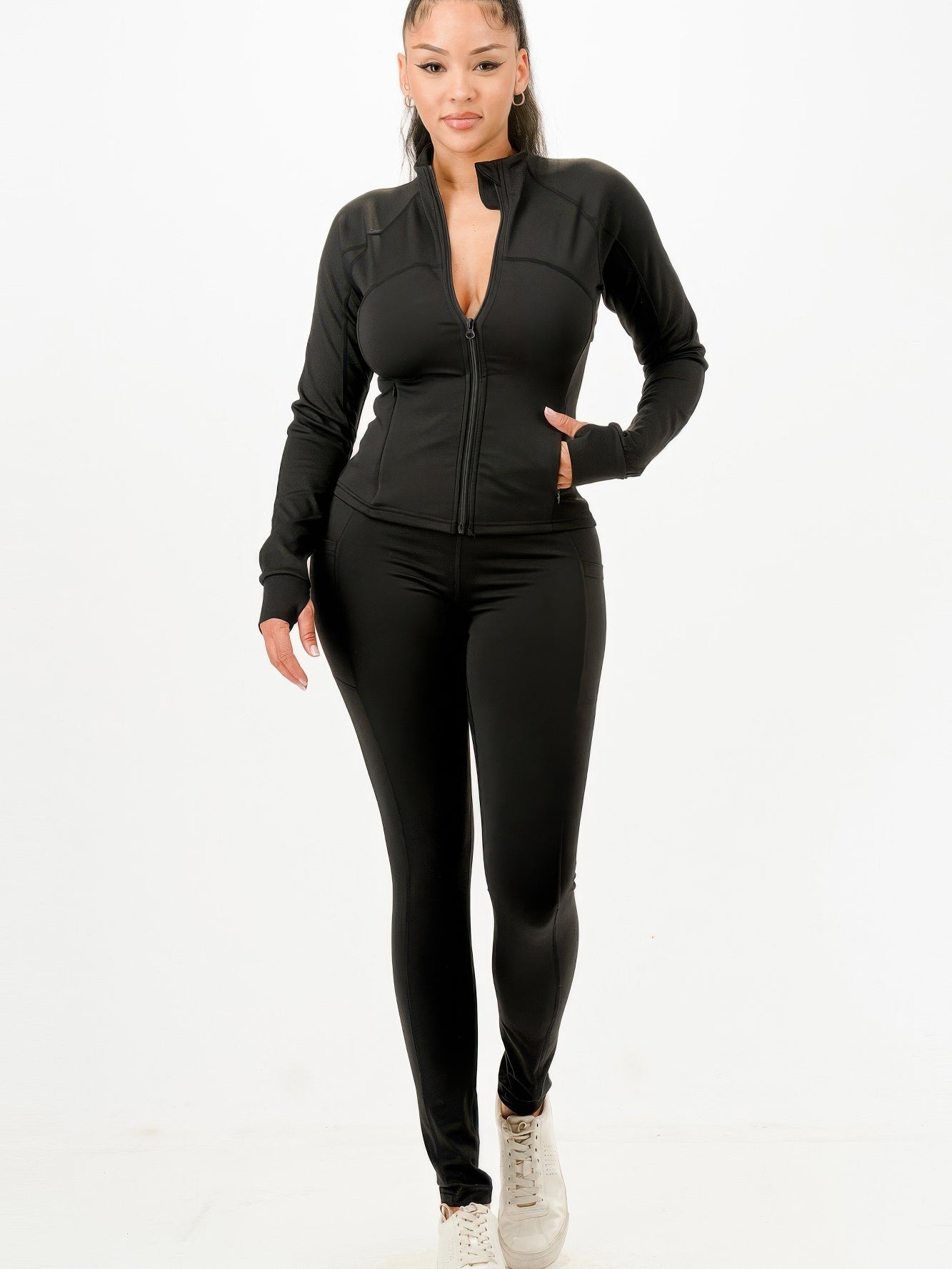 Activewear jacket and legging set in black, designed for performance and style, ideal for workouts and casual wear.